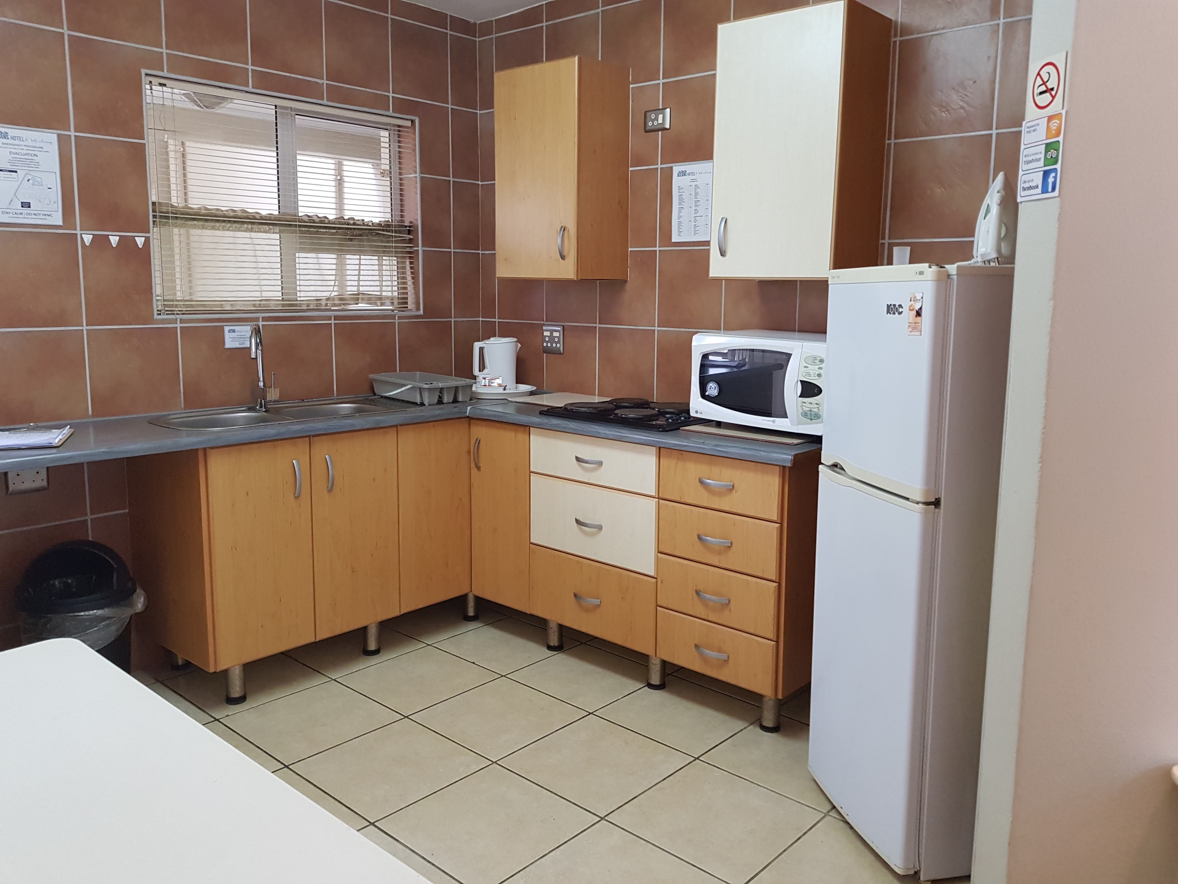 Oceans Hotel-guestroom-Self Catering Villa Kitchen.jpg