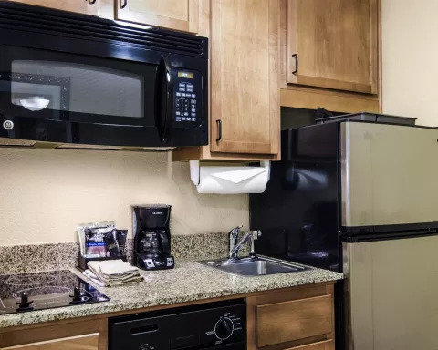 Affordable Suites of America R-guestroom-SNQ Queen Suite Kitchen Kitchenette.jpg