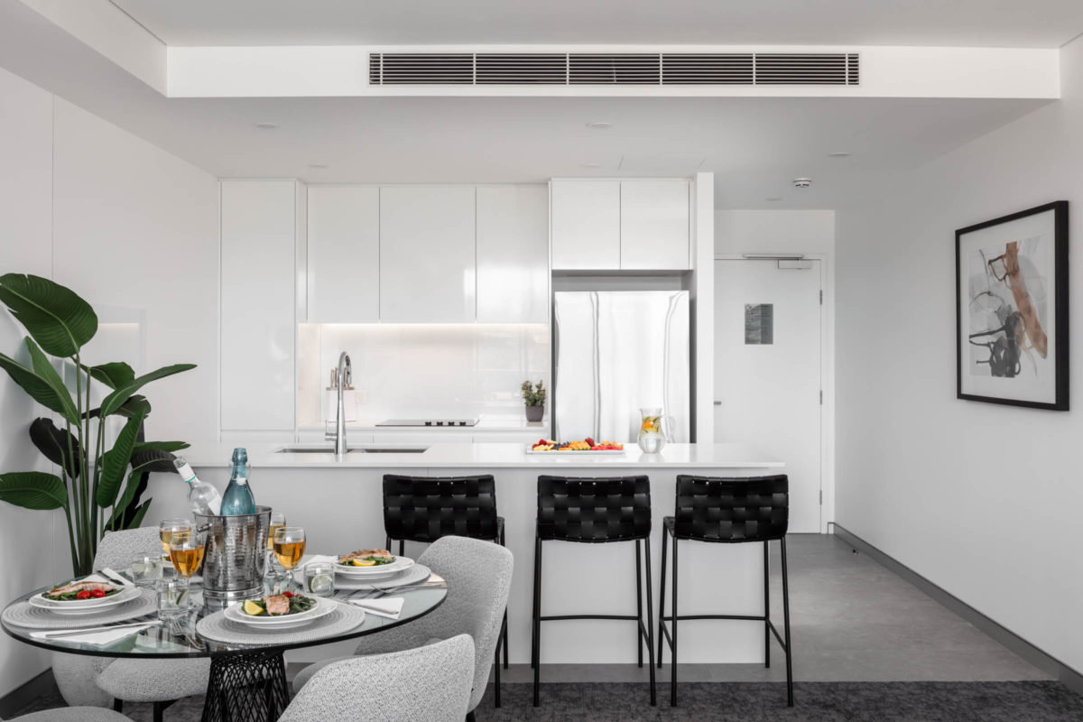 Argo Apartments-guestroom-Dinner Table With Food And Kitchen.jpg