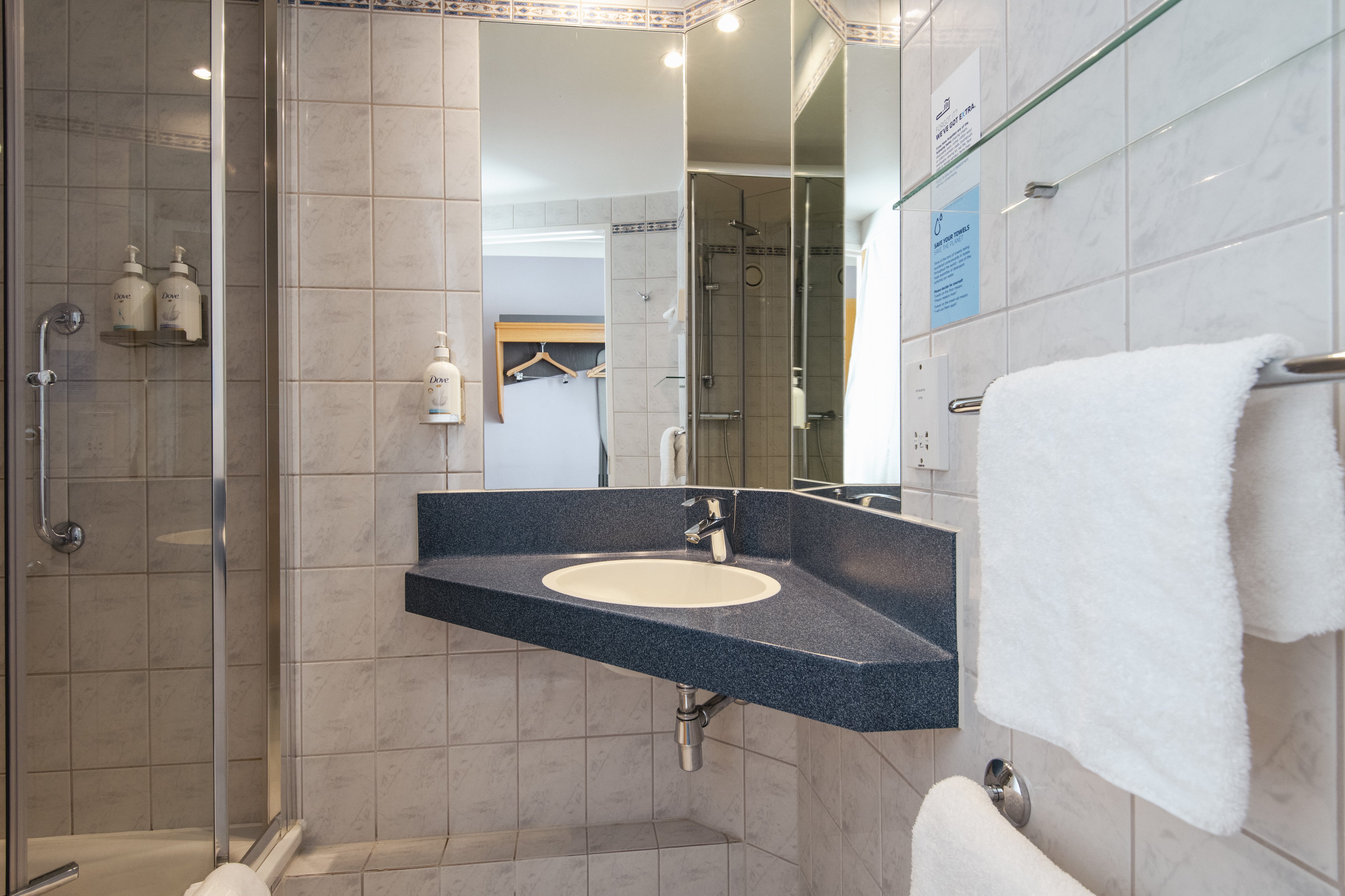 HOLIDAY INN EXPRESS WANDSWORTH BY I-guestroom-The en-suites feature a power shower and Dove toiletries..jpg