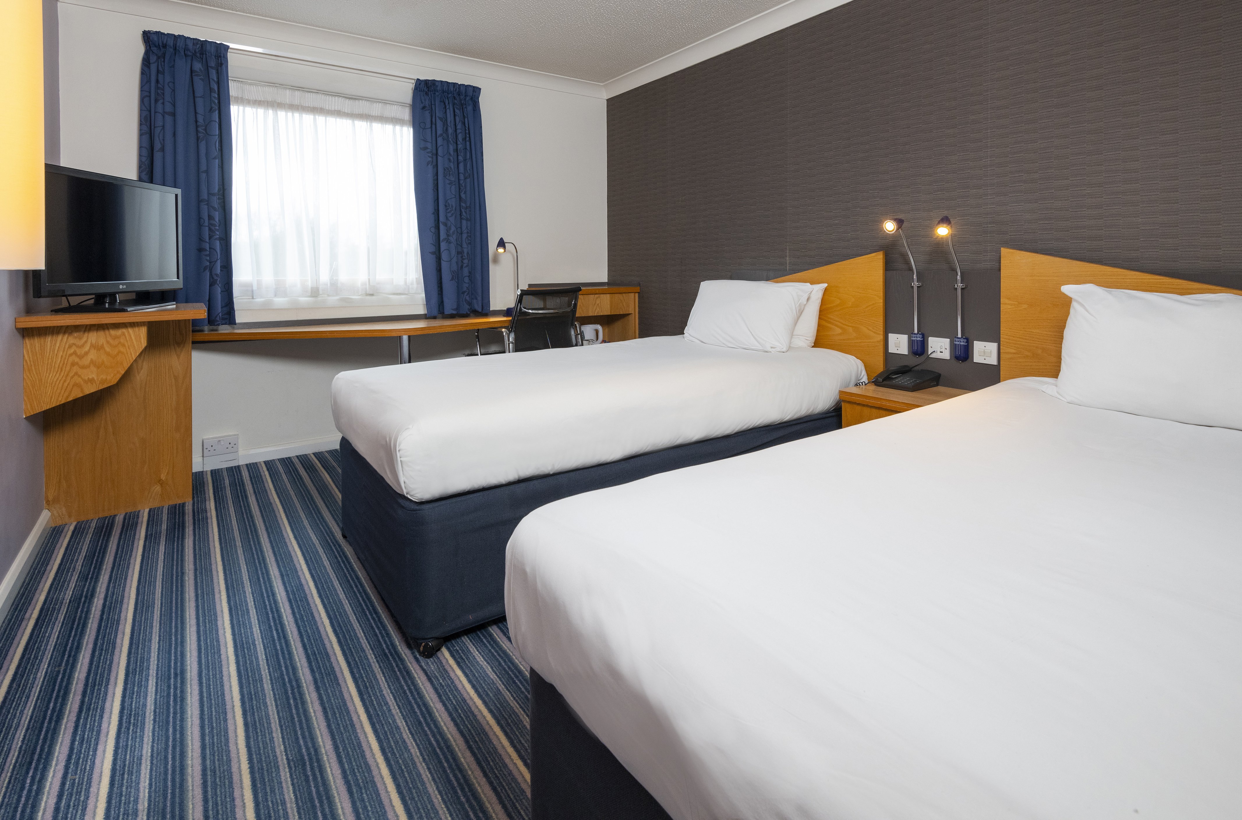 HOLIDAY INN EXP CHINGFORD BY IHG-guestroom-Busy day in Chingford? Kick back and watch the TV in your room..jpg