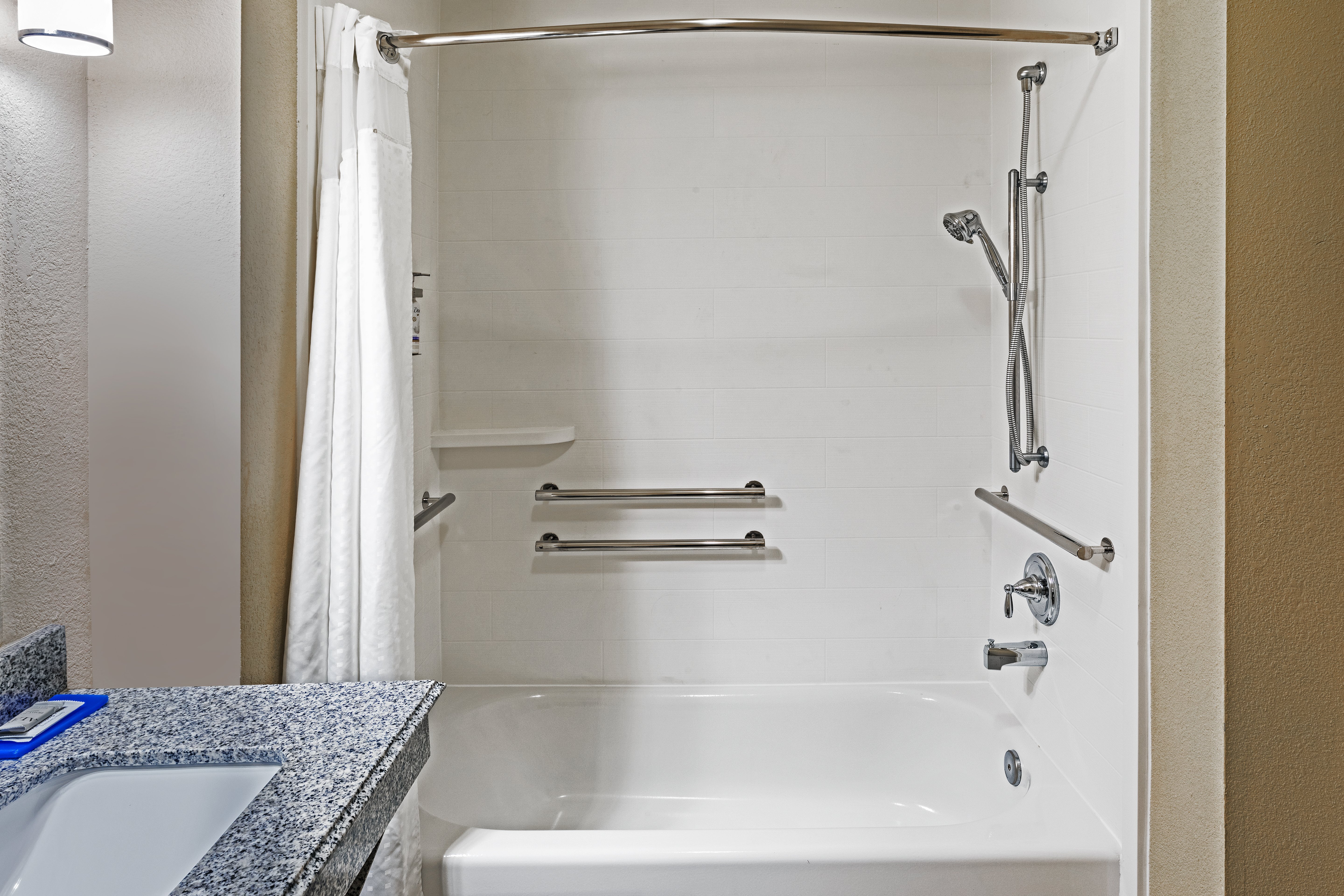 HOLIDAY INN EXP STES SPACE CTR BY I-guestroom-Accessible Tub.jpg