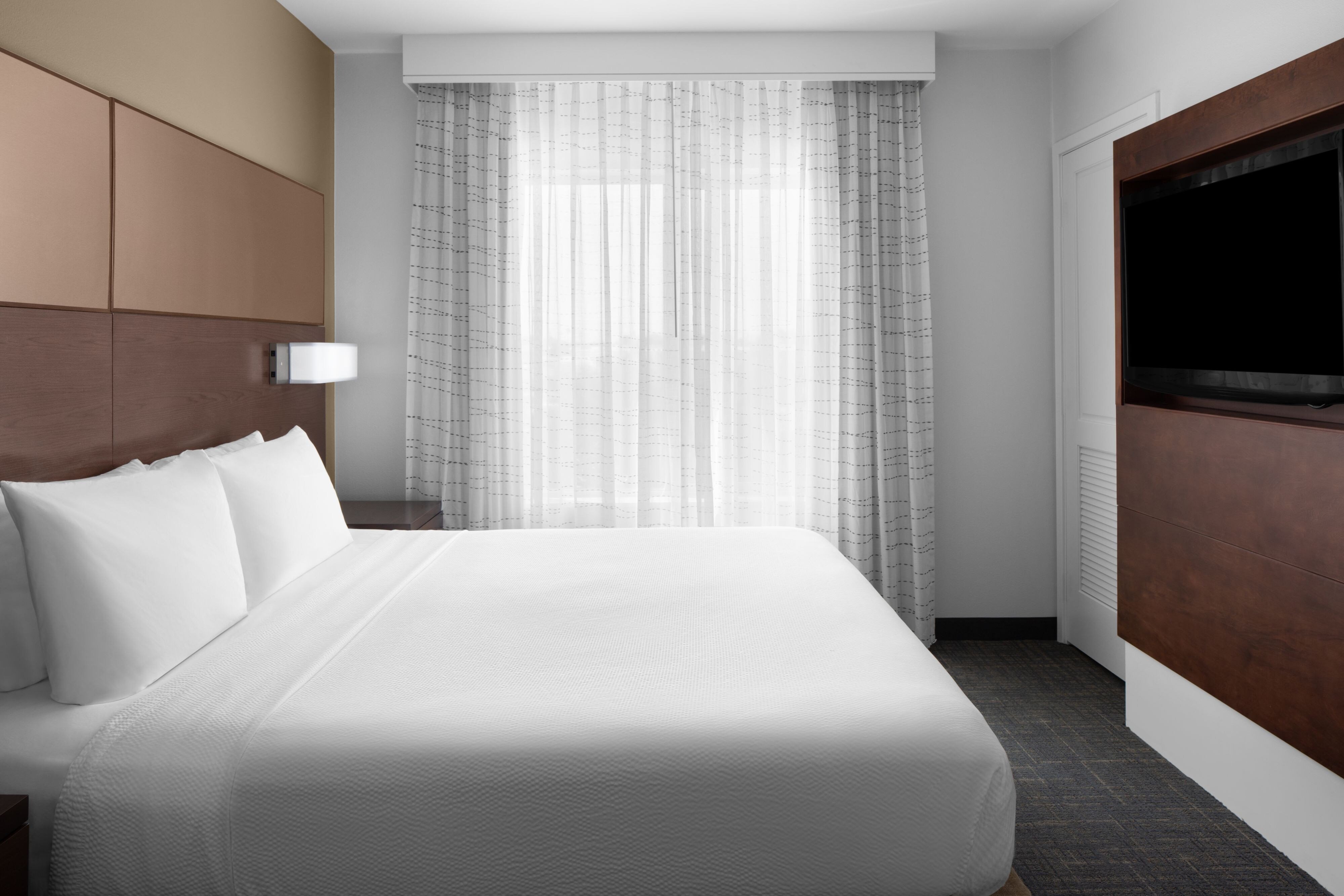 Residence Inn by Marriott Tustin Orange County-guestroom-King Suite Bedroom.jpg