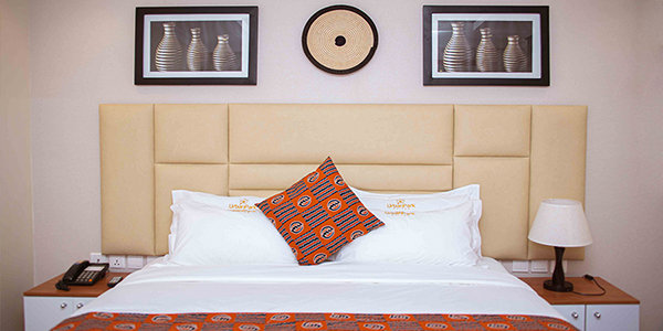 URBAN PARK SUITES-guestroom-Bed.jpg