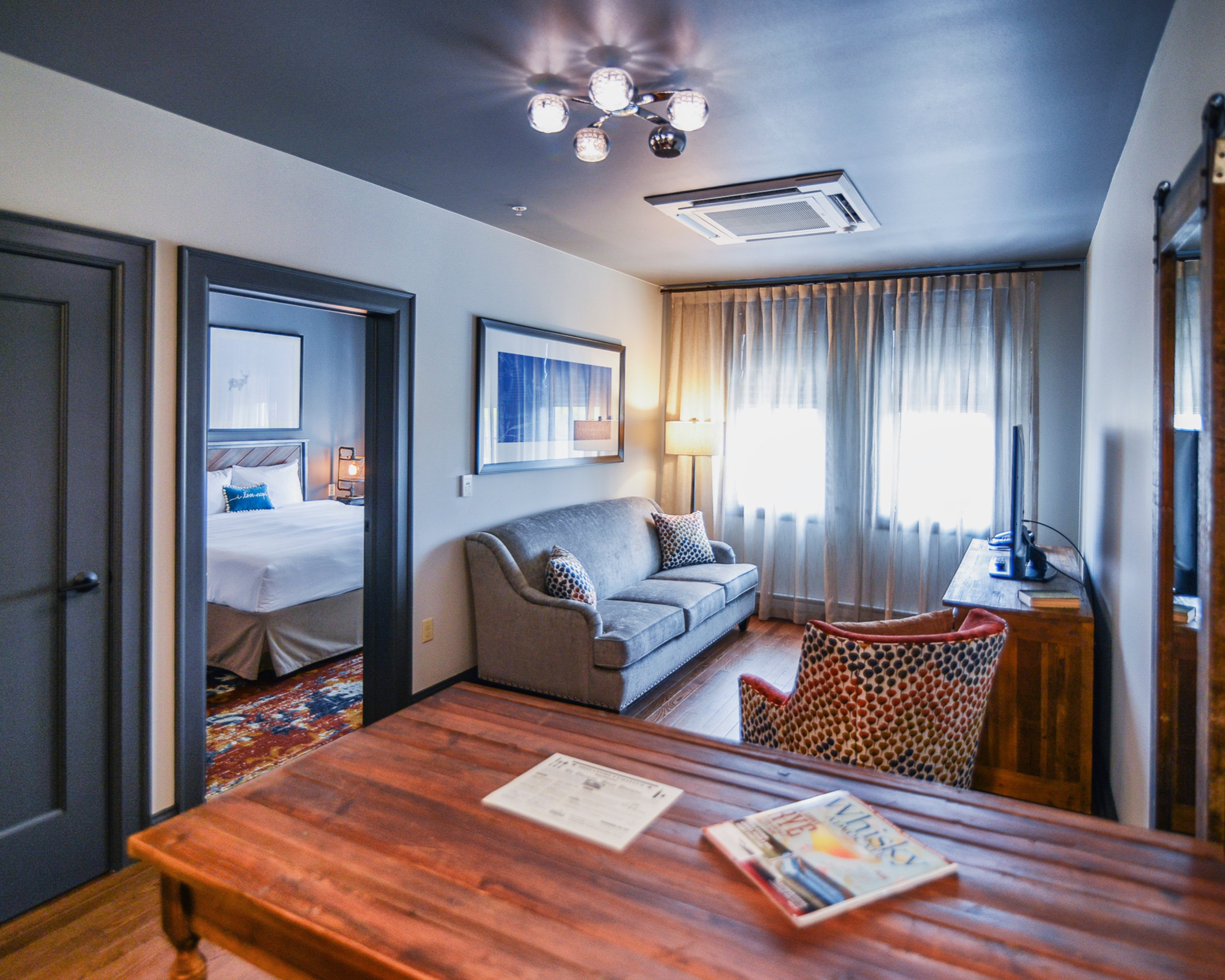 STELLA HOTEL AND BALLROOM-guestroom-Heritage One Bedroom King Suite Living/Working Area.jpg
