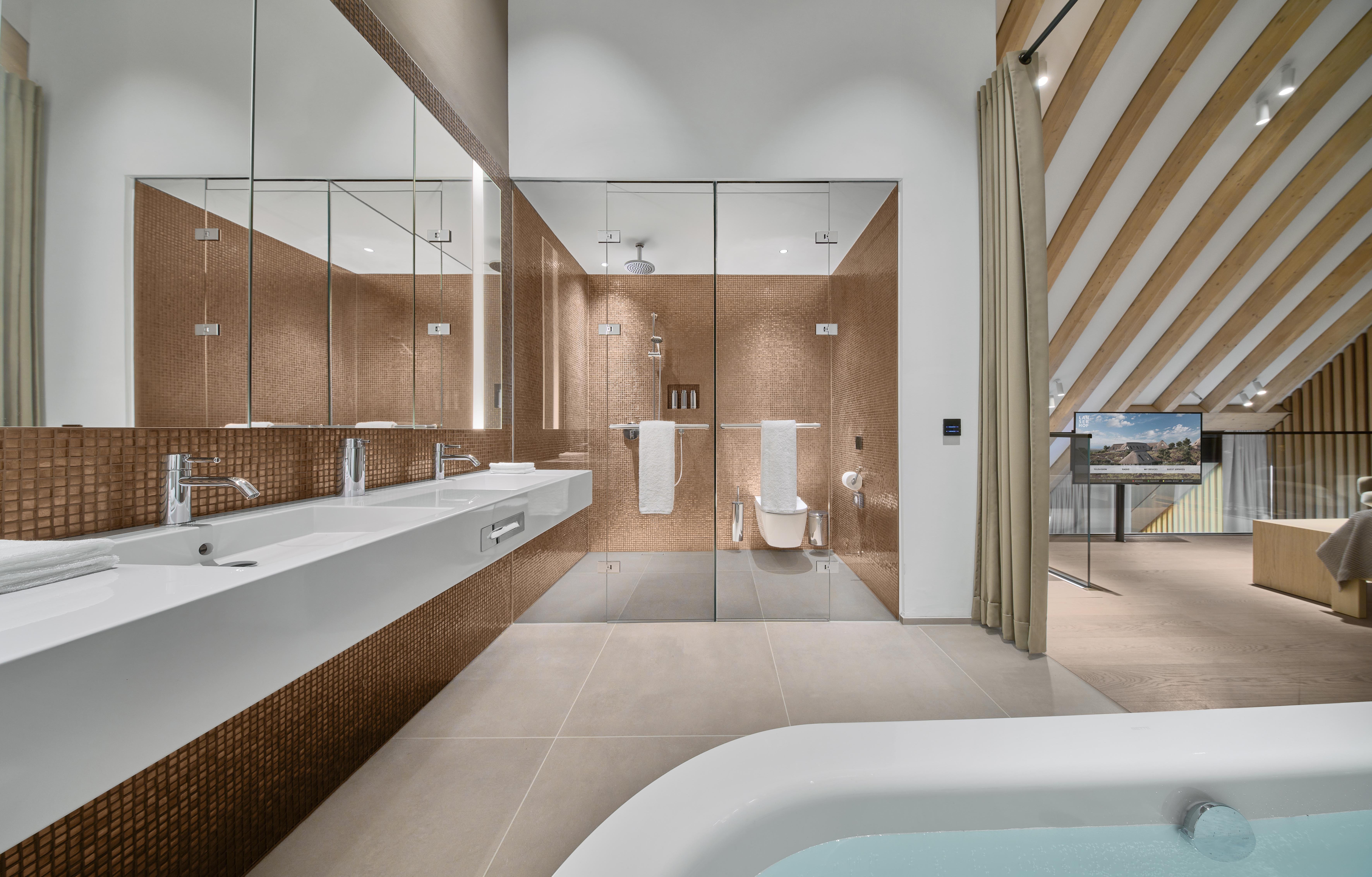 LANSERHOF SYLT MEDICAL HEALTH-guestroom-Junior Suite, Parvus Duplex Suite Bathroom.jpg