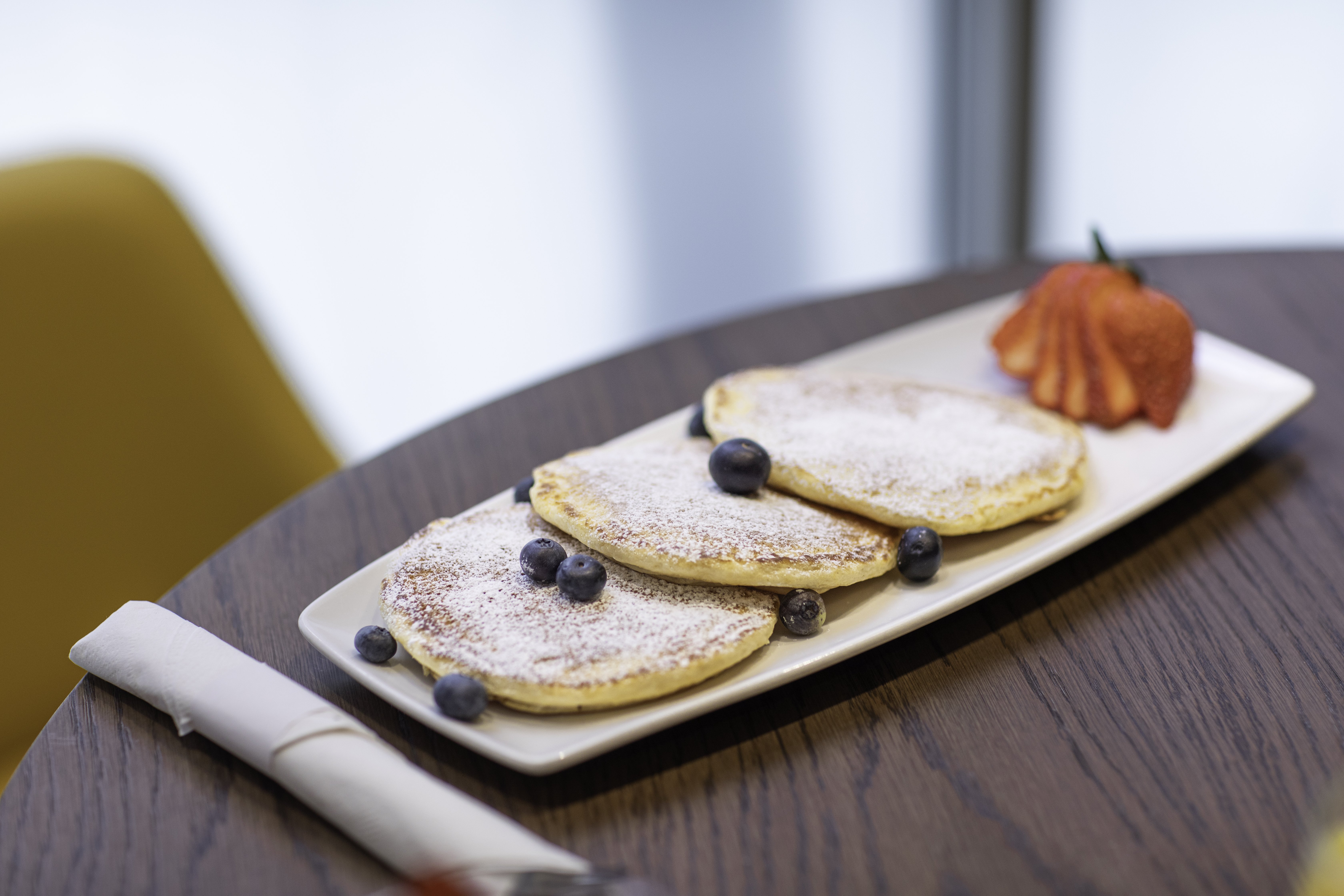 Start your morning with our blueberry pancakes.