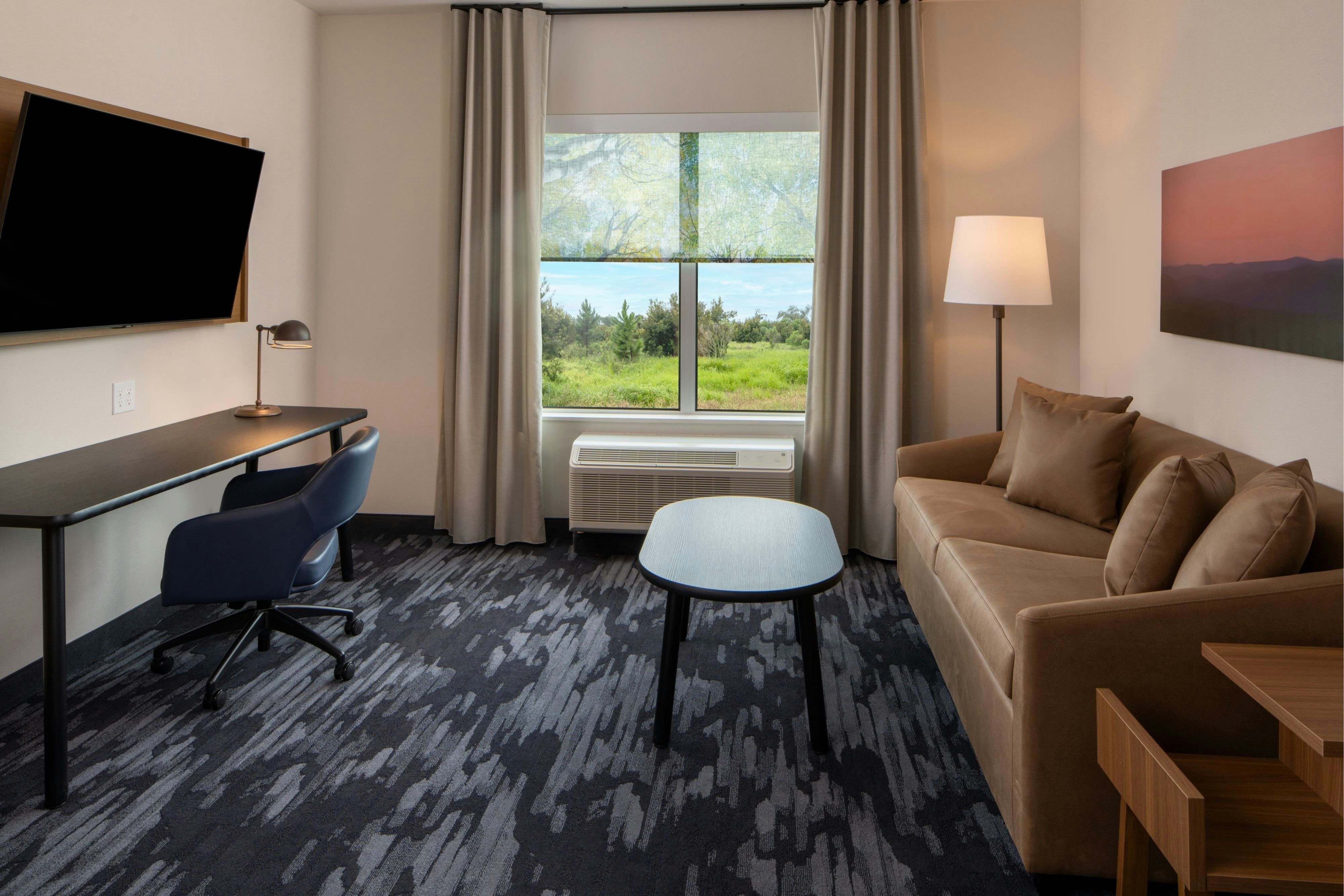 Fairfield by Marriott Inn and Suites Foley-guestroom-Suite Pullout Sofa/Desk.jpg