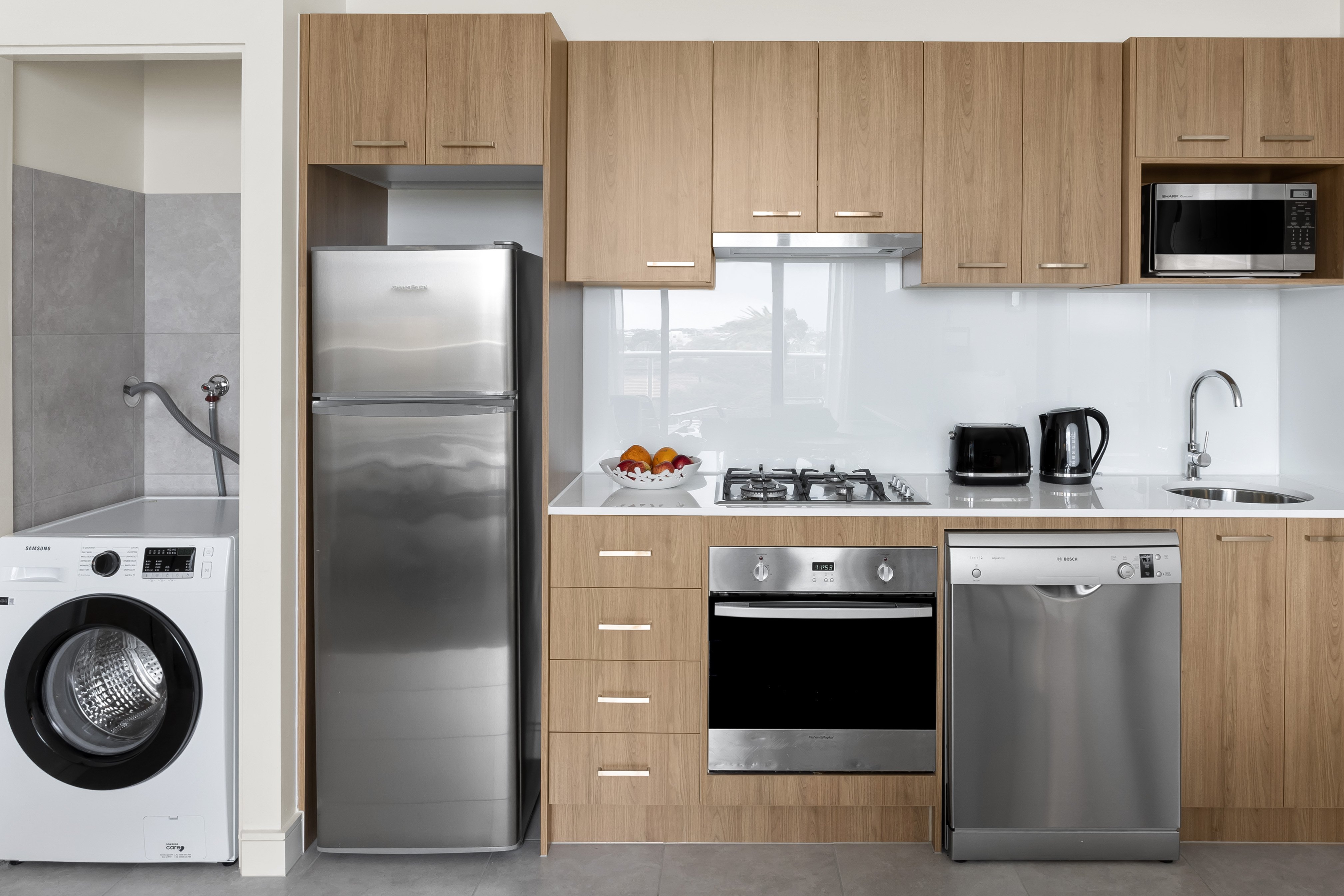 Quest Ivanhoe-guestroom-One Bedroom Deluxe Easy Accessible Kitchen Laundry Area.jpg