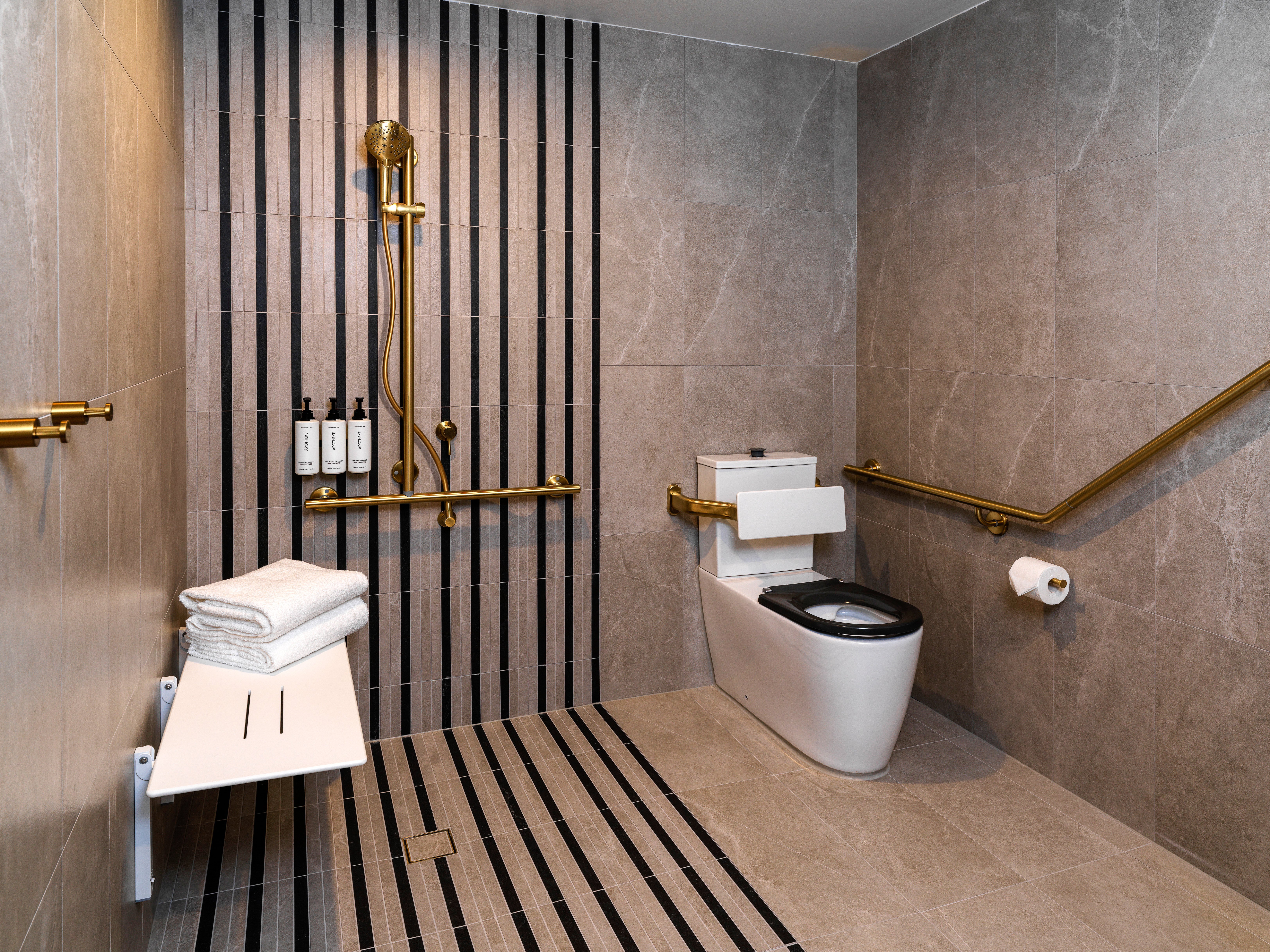 VOCO GOSFORD BY IHG-guestroom-Hotel accessible bathroom offering comfort and convenience.jpg