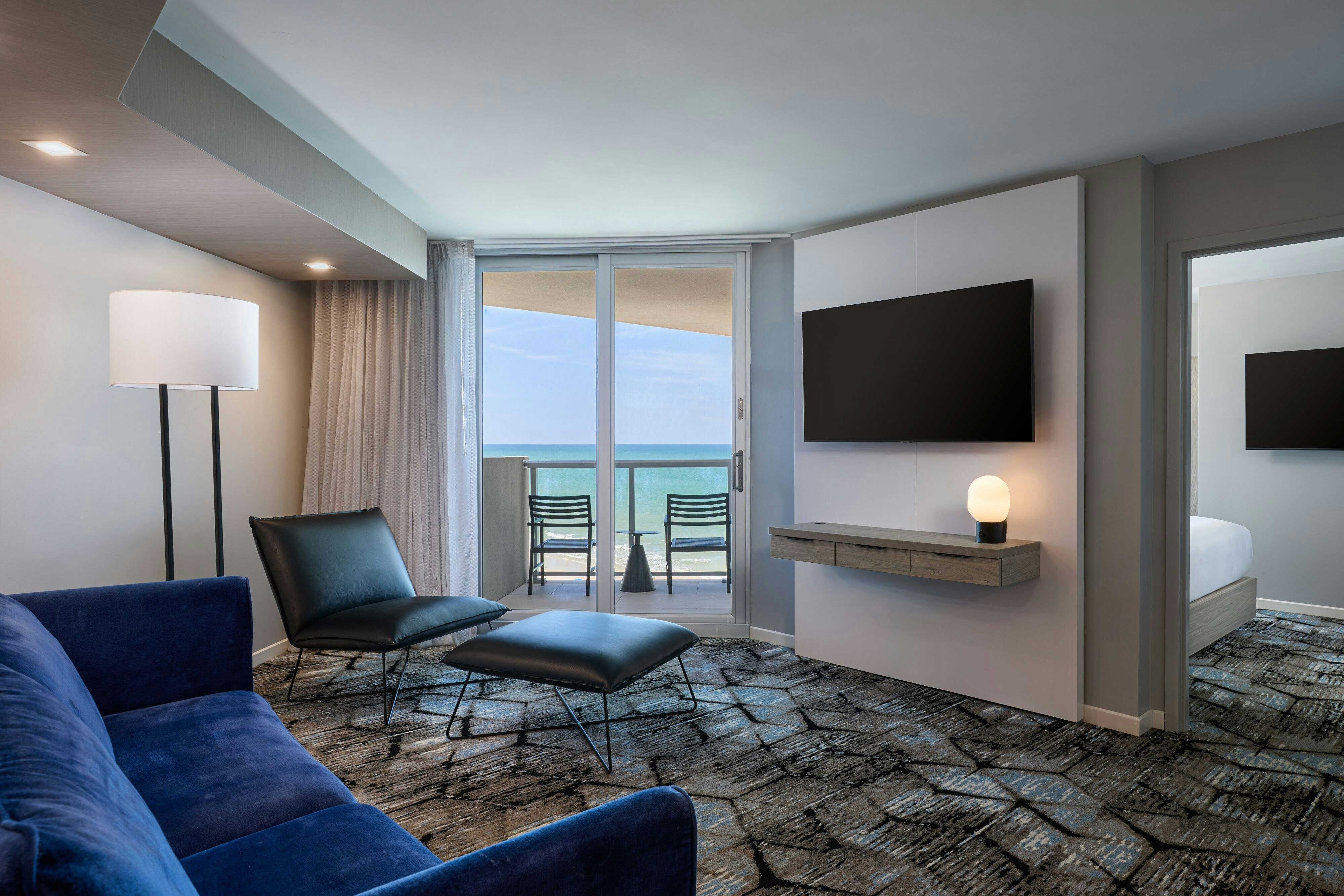 Renaissance Daytona Beach Oceanfront Hotel-guestroom-Suite Living Room.jpg