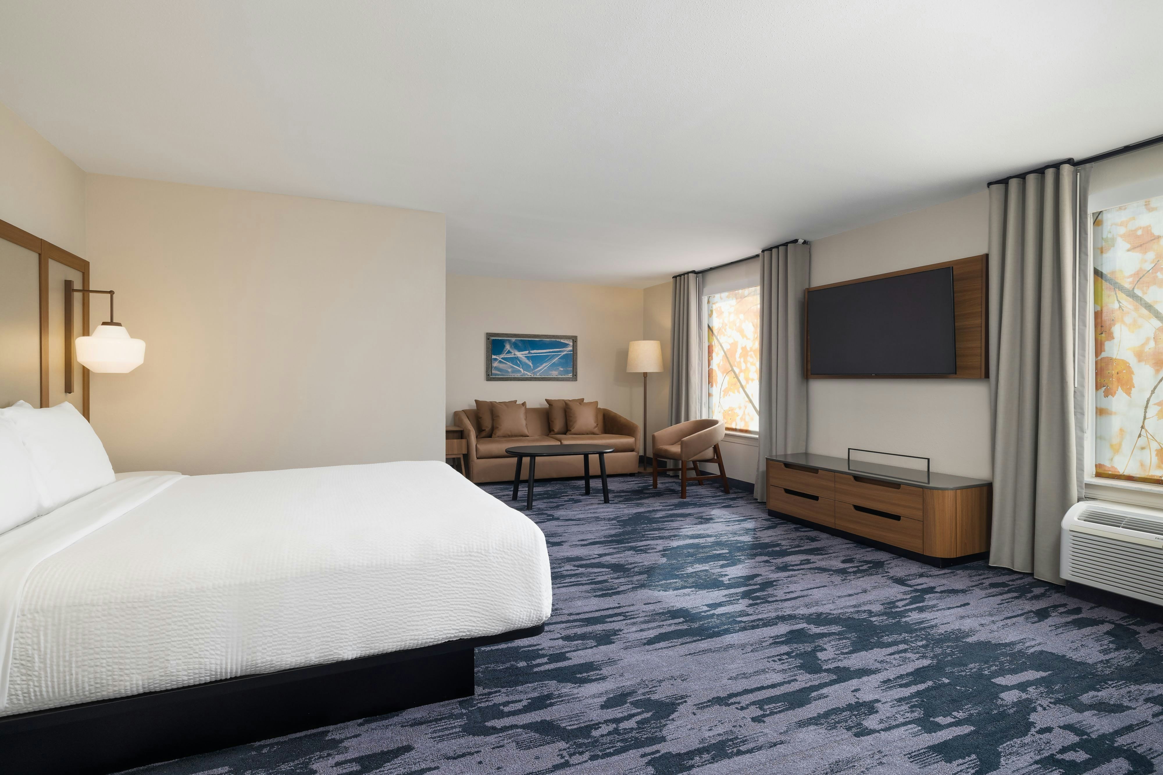 FAIRFIELD INN N SUITES CLINTON-guestroom-Suite with 1 King Bed.jpg